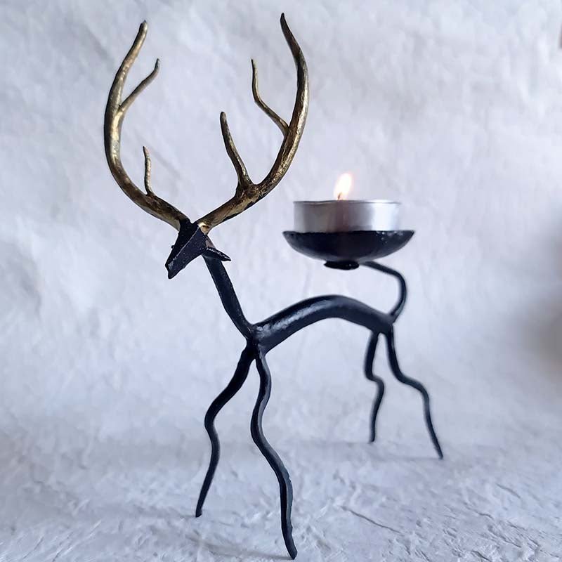 Handcrafted Bastar wrought iron golden deer tealight holders. Set of 2 artisan pieces for warm, elegant home décor.
