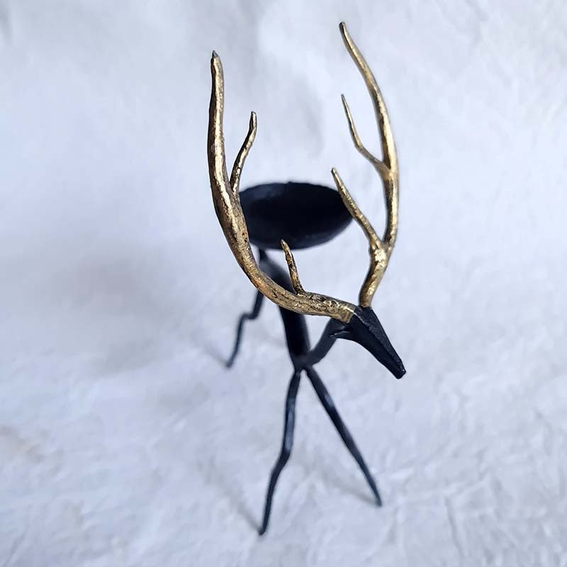 Handcrafted Bastar wrought iron golden deer tealight holders. Set of 2 artisan pieces for warm, elegant home décor.