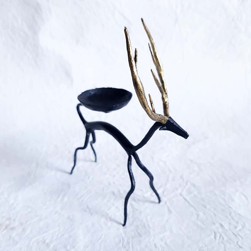 Handcrafted Bastar wrought iron golden deer tealight holders. Set of 2 artisan pieces for warm, elegant home décor.