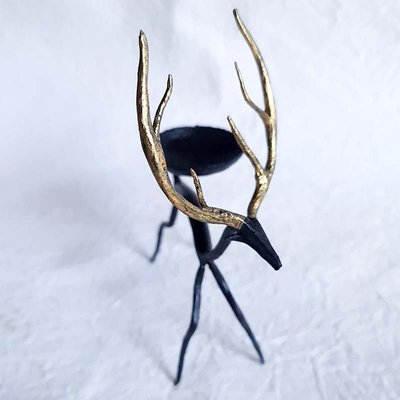 Handcrafted Bastar wrought iron golden deer tealight holders. Set of 2 artisan pieces for warm, elegant home décor.