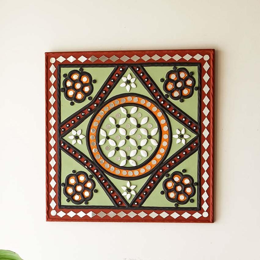 Green patterned handcrafted mud and mirror wall art, adding a rustic and artistic touch 