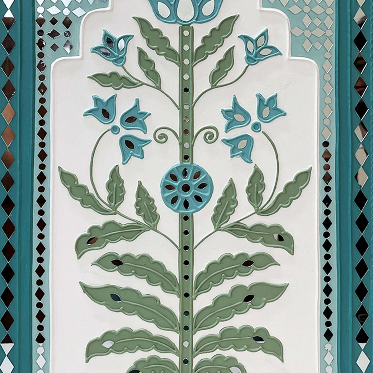 Handmade white & light green lippan wall hanging with mud and mirror work from Kutch.