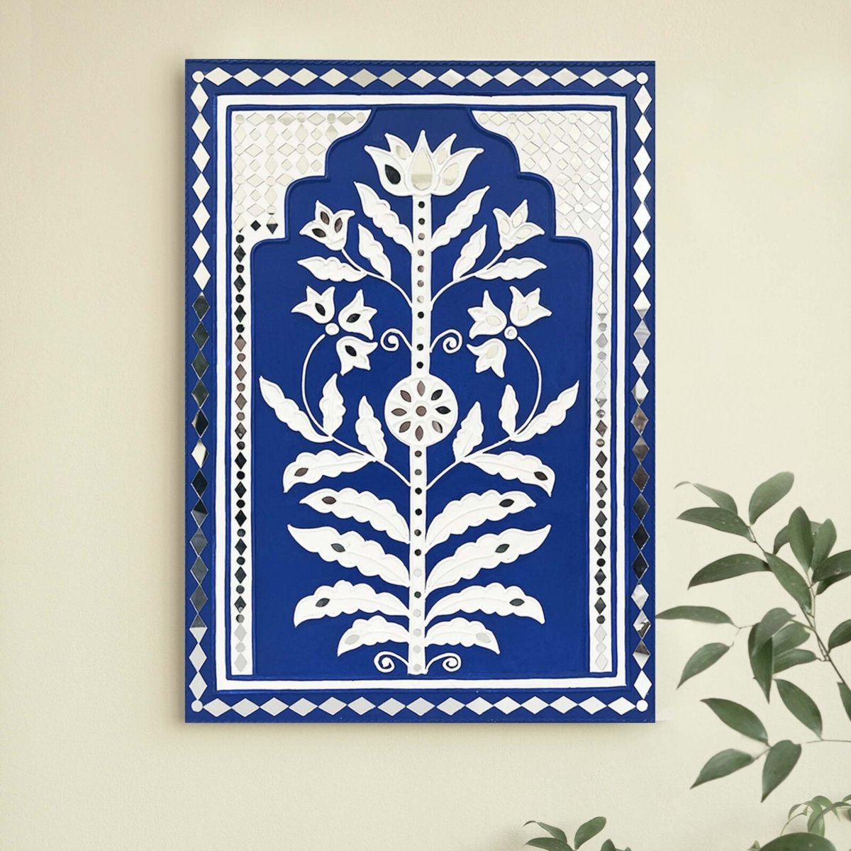 Handmade blue sparkle mud art wall hanging crafted with mud and mirrors from Kutch.