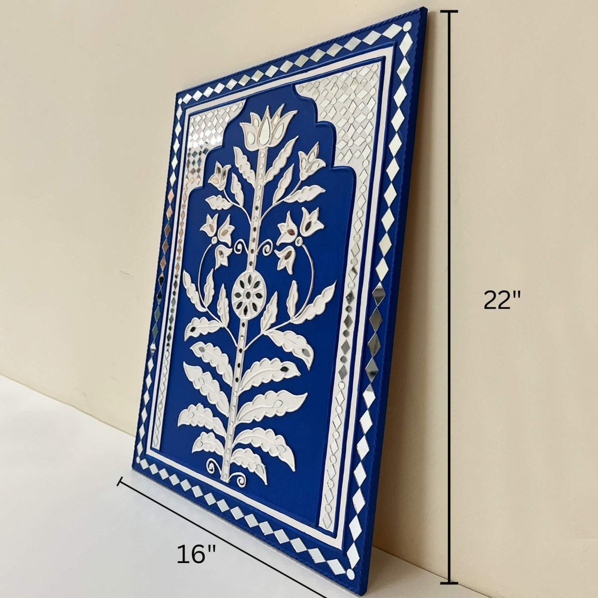 Handmade blue sparkle mud art wall hanging crafted with mud and mirrors from Kutch.