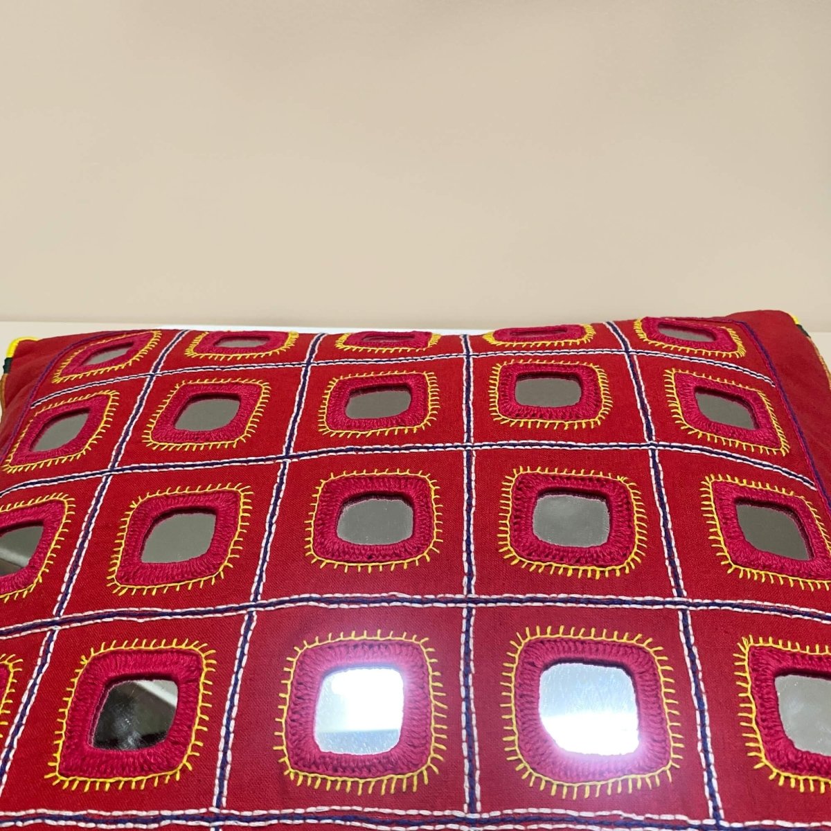 Red Lambani Starlight cushion cover, showcasing traditional artistry