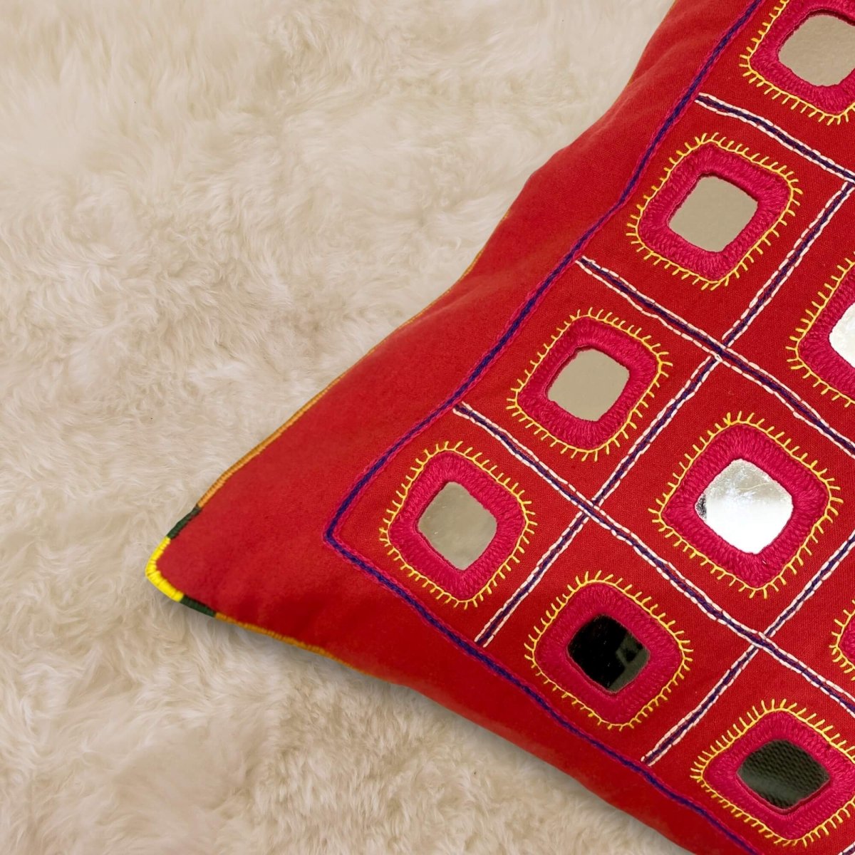 Red Lambani Starlight cushion cover, showcasing traditional artistry