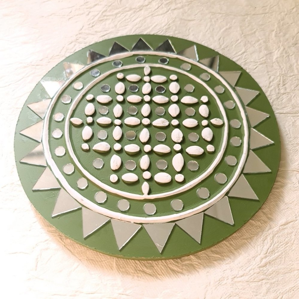 Olive round handcrafted mud and mirror work wall art, adding a rustic and elegant touch