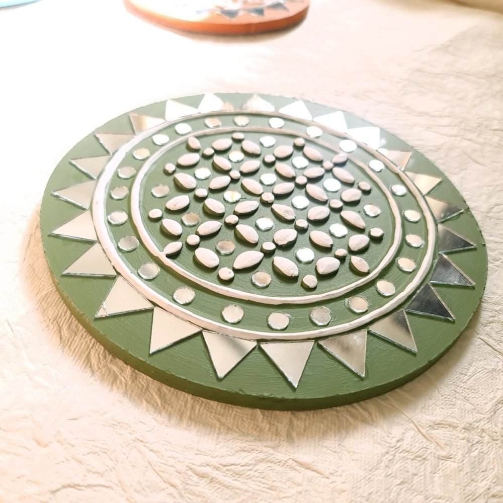 Olive round handcrafted mud and mirror work wall art, adding a rustic and elegant touch