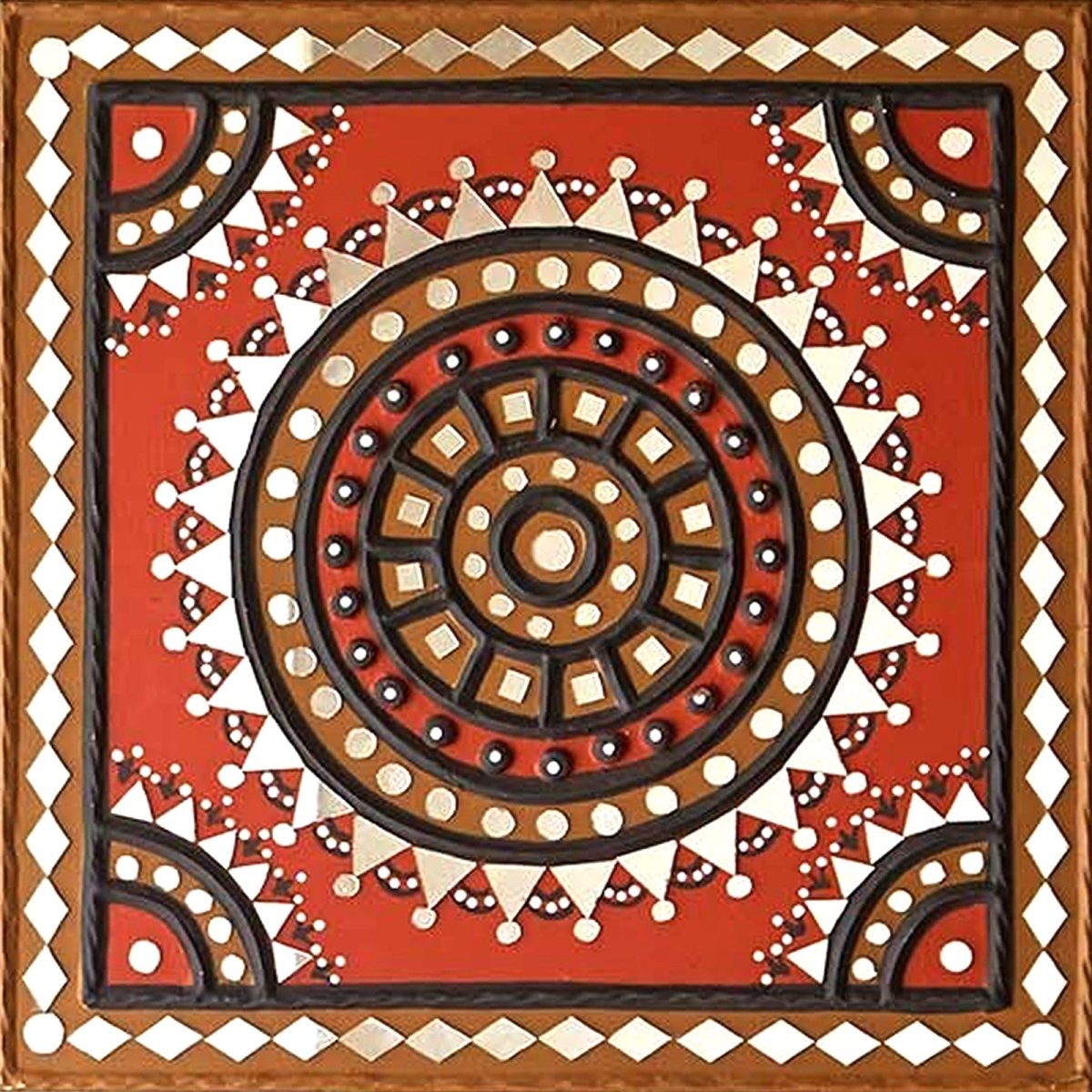 Handcrafted square mud wall art in red and black, adding a bold and artistic touch