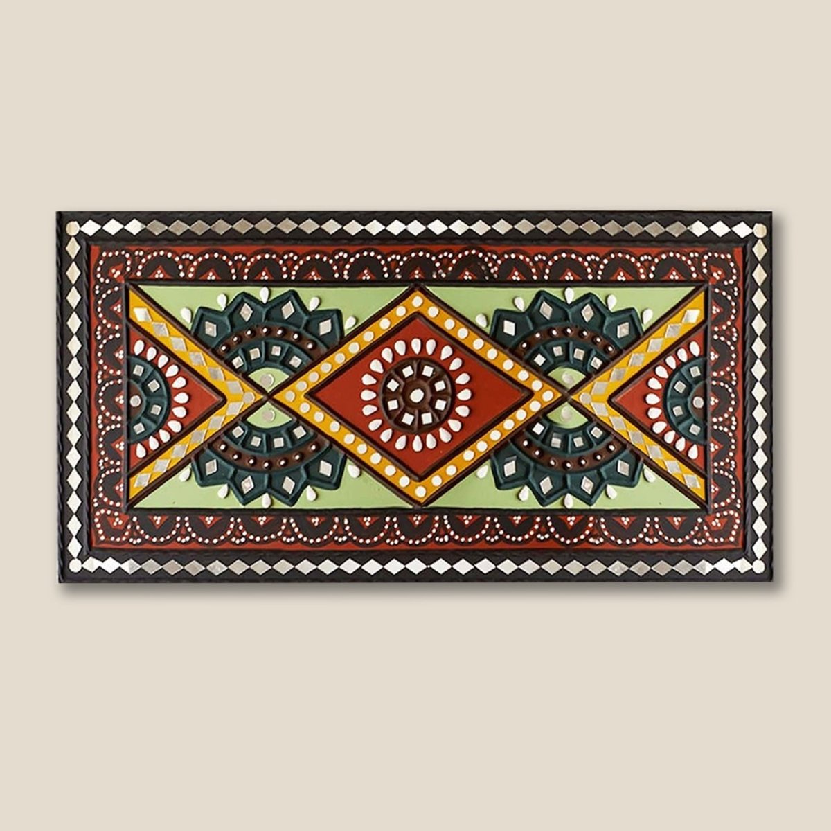 Green and brown handcrafted mud and mirror work wall art, adding a natural and earthy touch