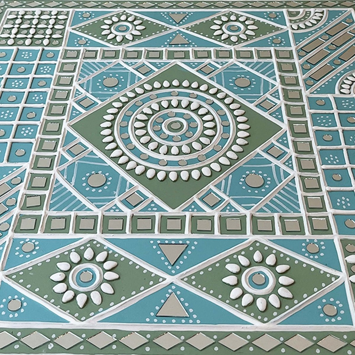 Handmade ocean blue sparkles lippan wall hanging with mud and mirror work from Kutch.