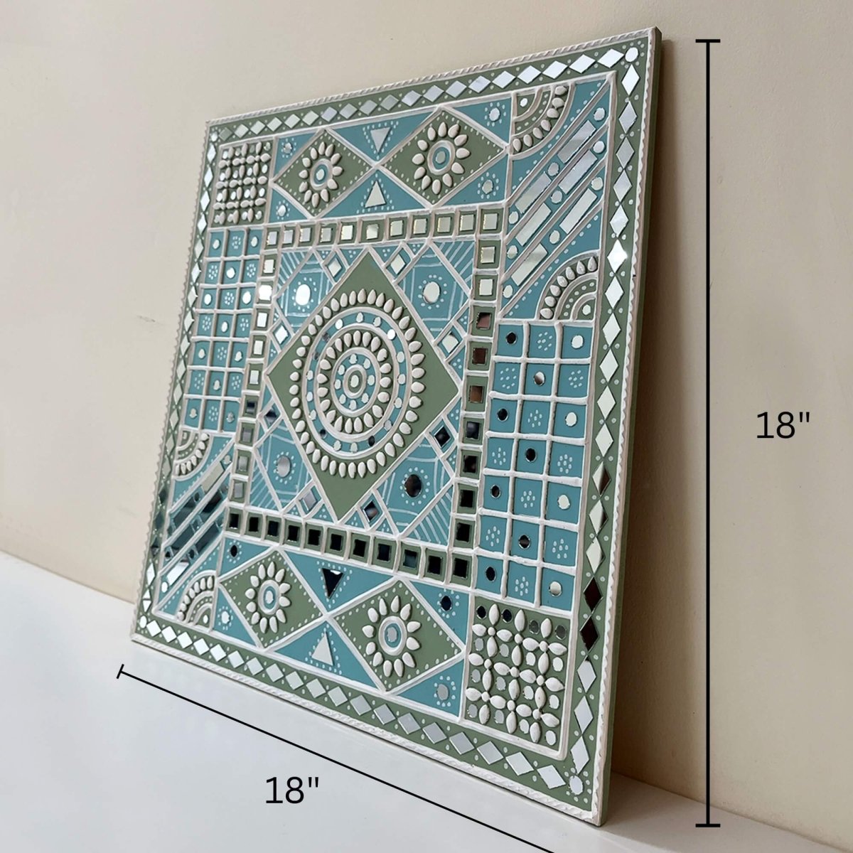 Handmade ocean blue sparkles lippan wall hanging with mud and mirror work from Kutch.