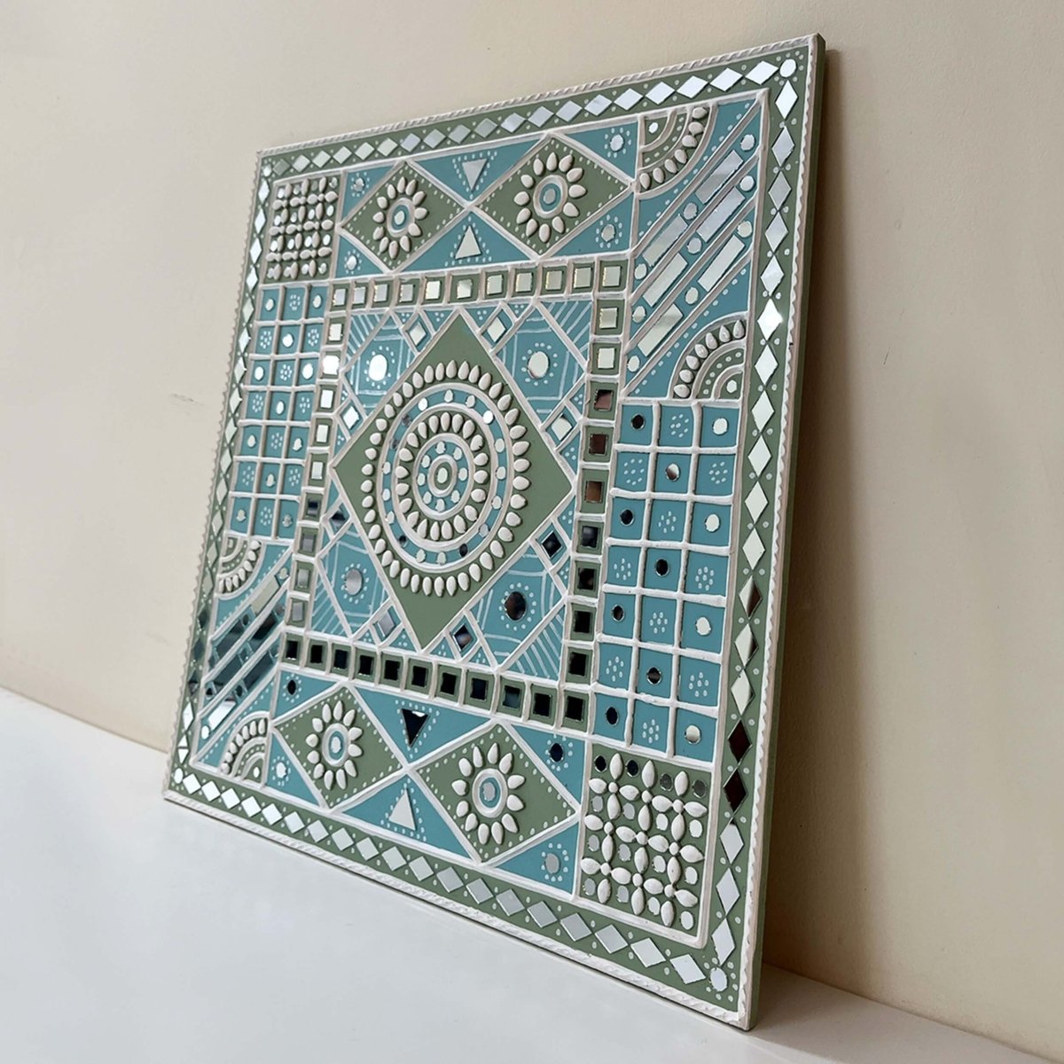 Handmade ocean blue sparkles lippan wall hanging with mud and mirror work from Kutch.